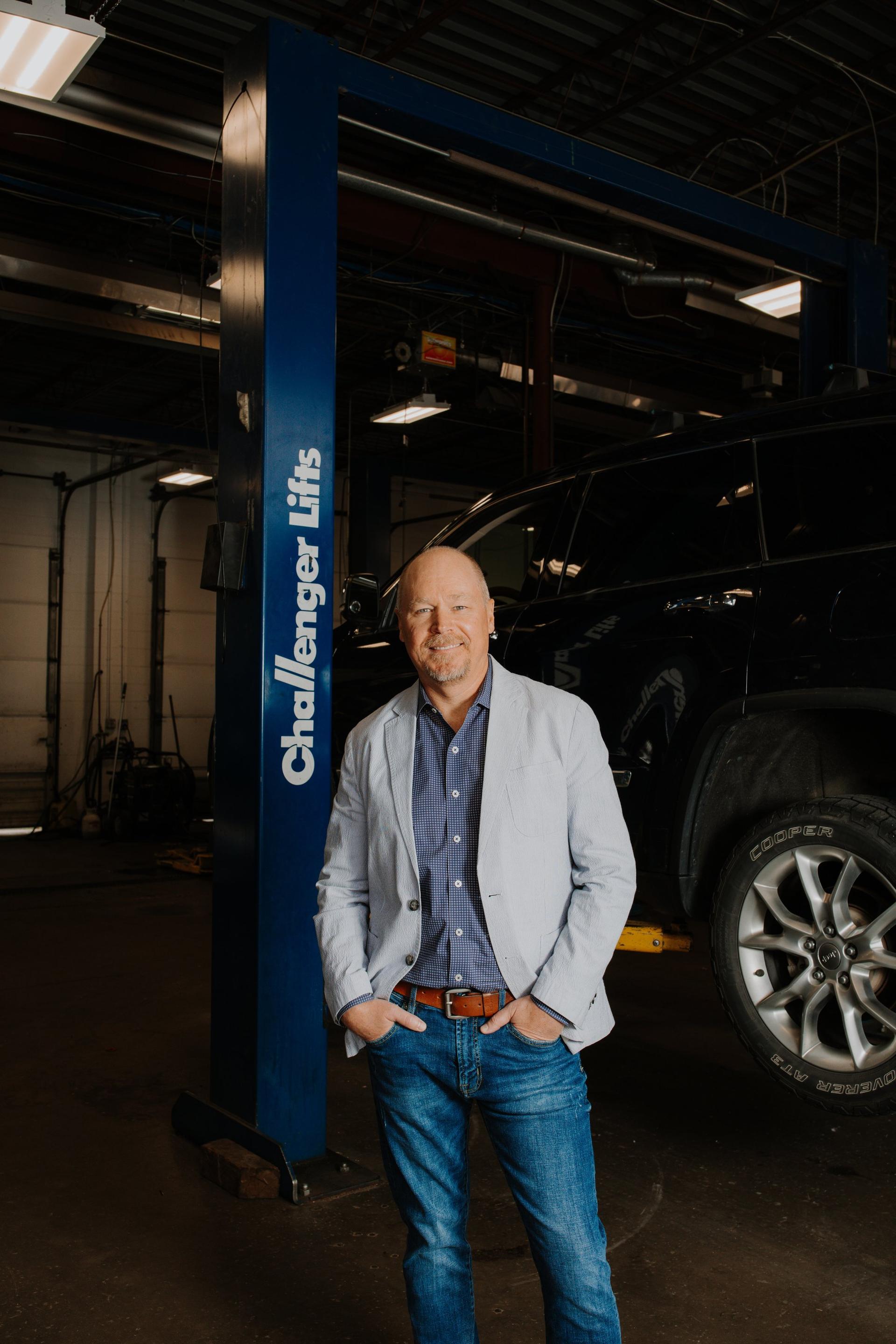 Dan Adam, founder of Adam & Son Auto Repair, standing in the shop